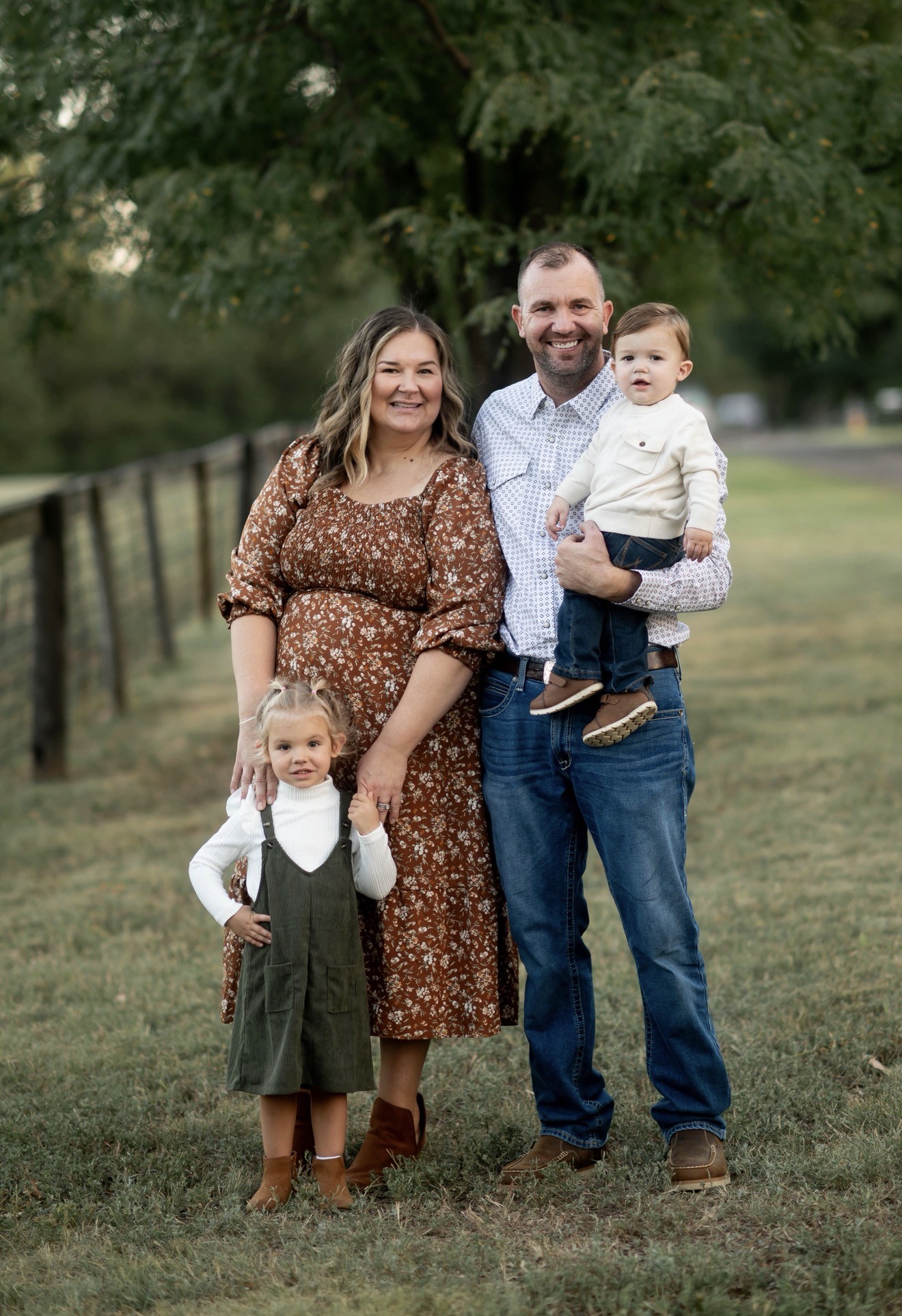 Dan and his wife with their two children outdoors